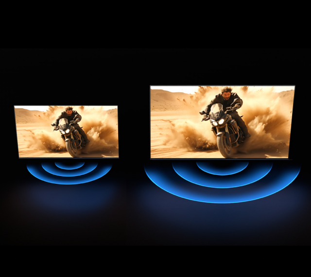 Two TVs of different sizes showing the same action scene, with sound waves visualized beneath each screen.