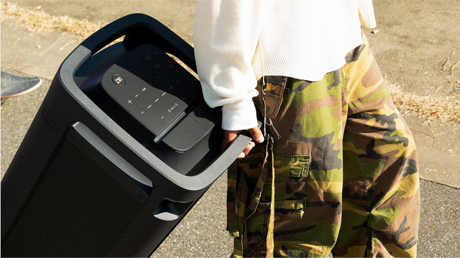 Person rolling ULT TOWER 9 using easy-to-carry handle.