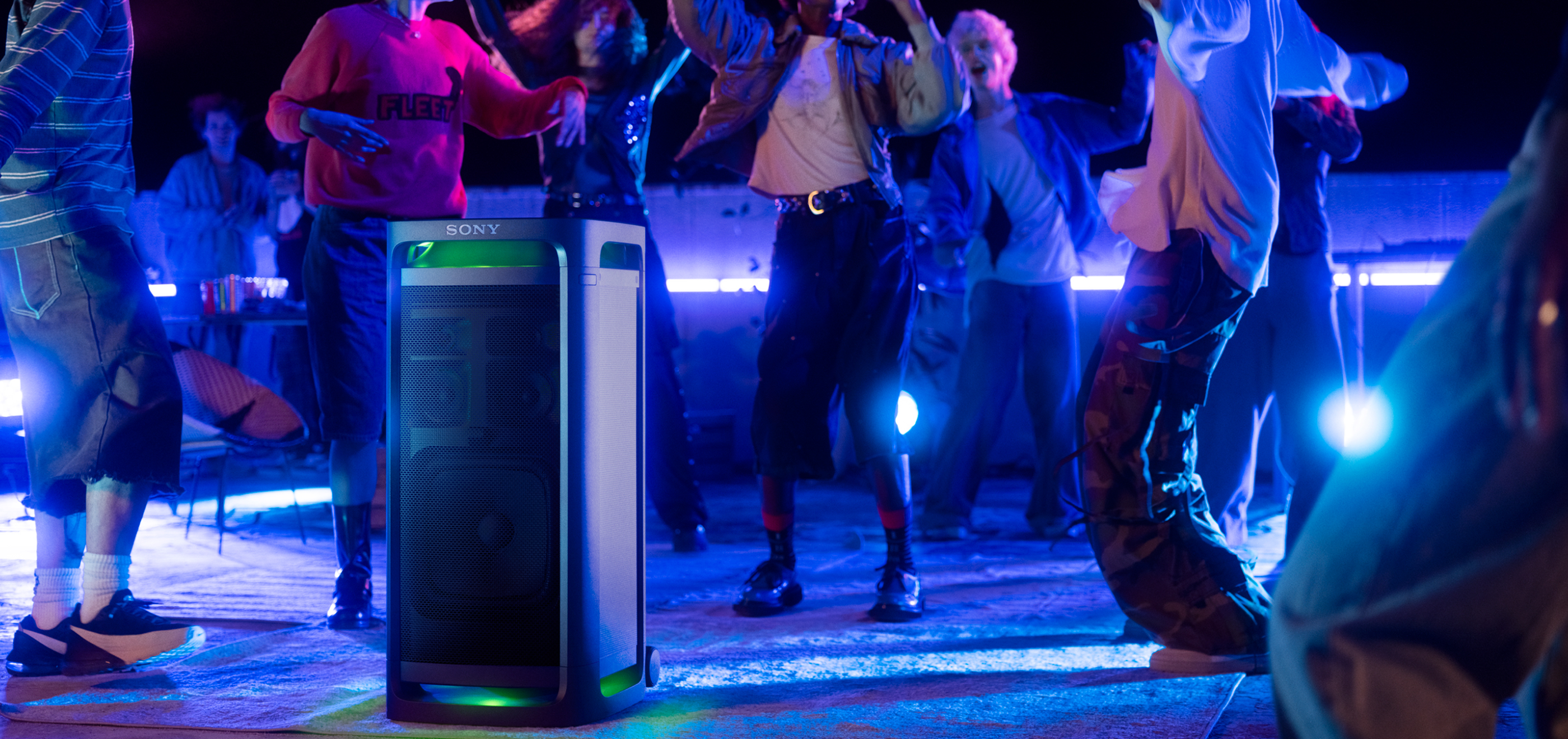 ULT TOWER 9 with people dancing in the background.