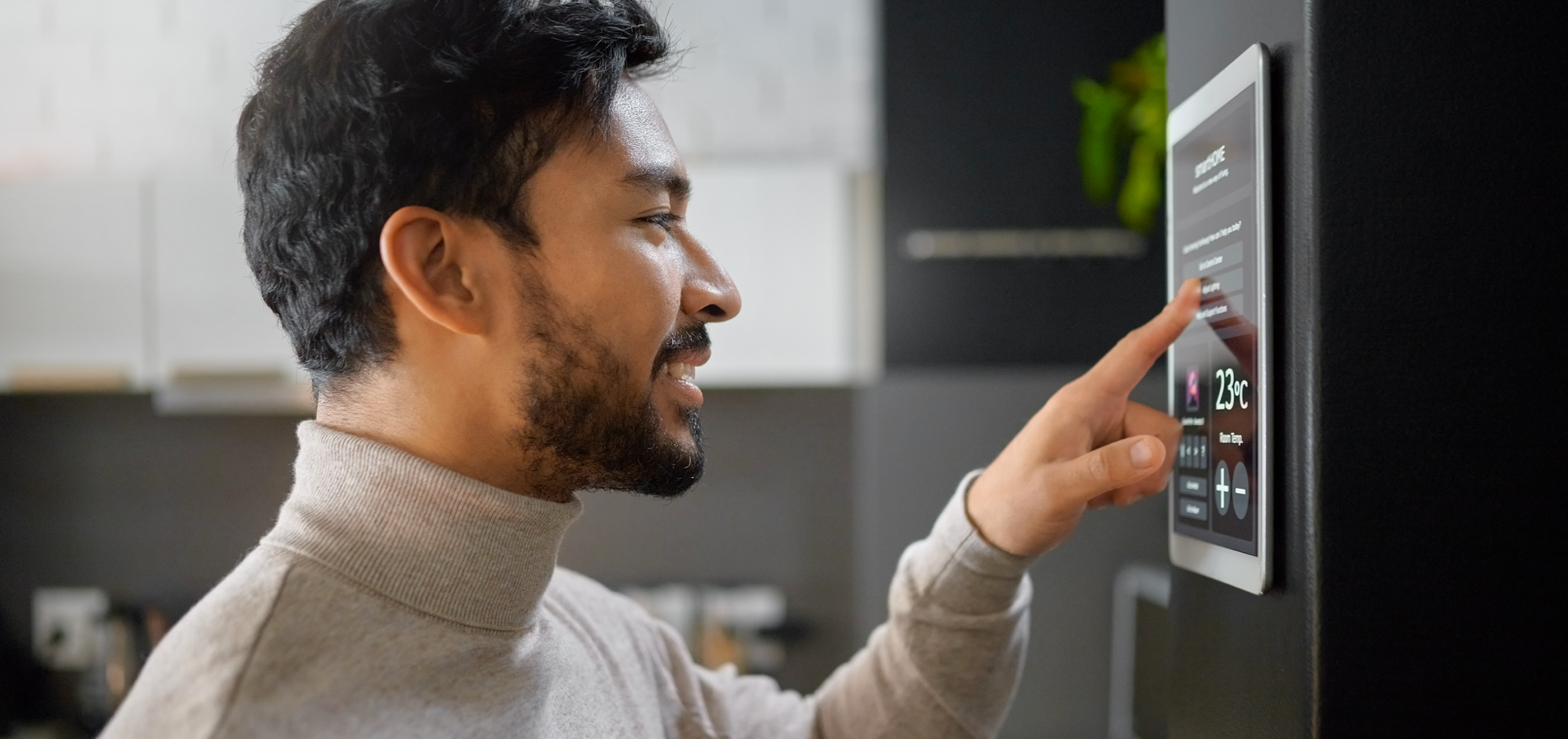 Image of man using a touchscreen indoors.