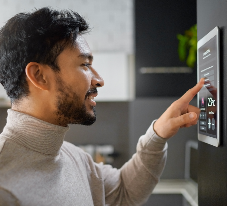 Image of man using a touchscreen indoors.