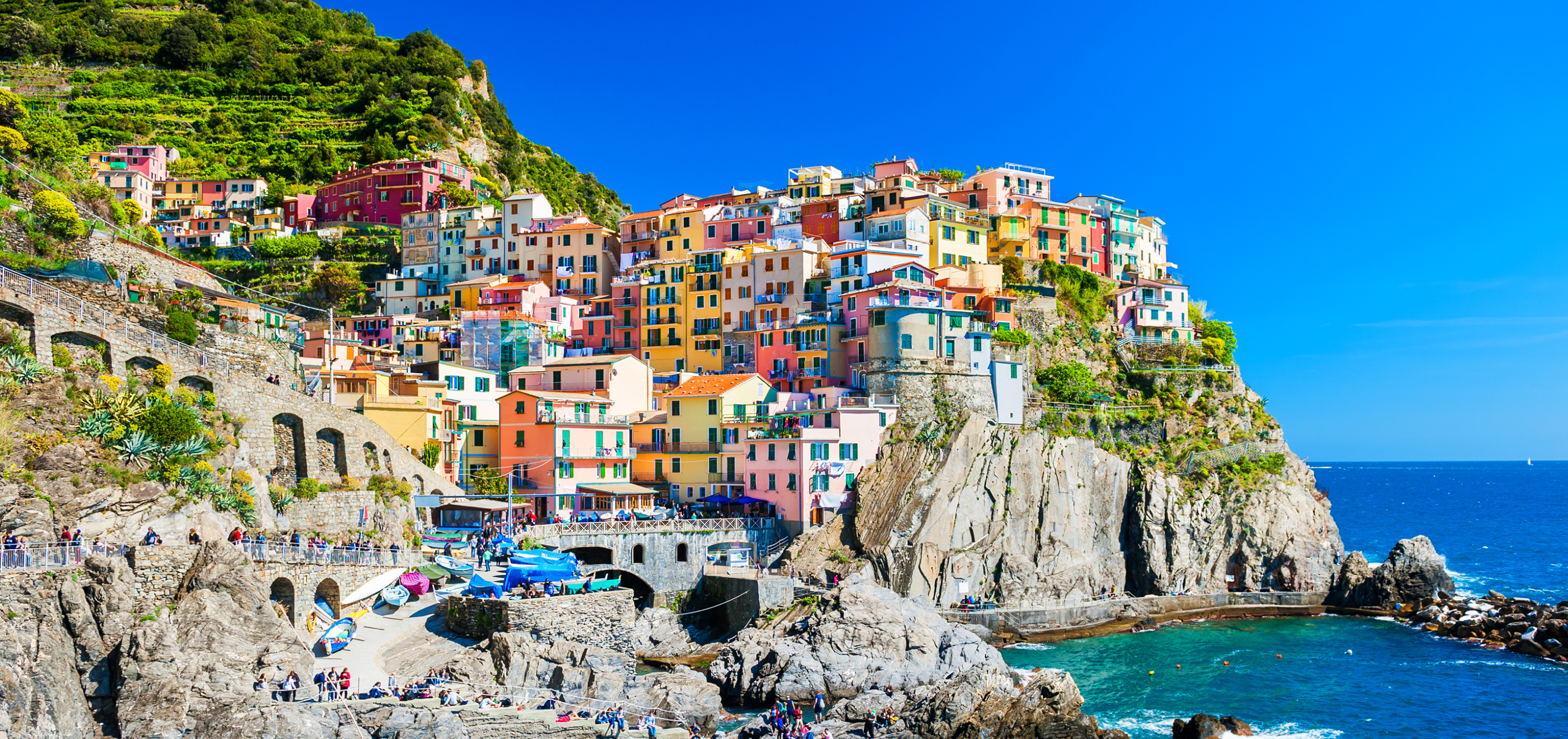 Image of colorful houses on a cliff.
