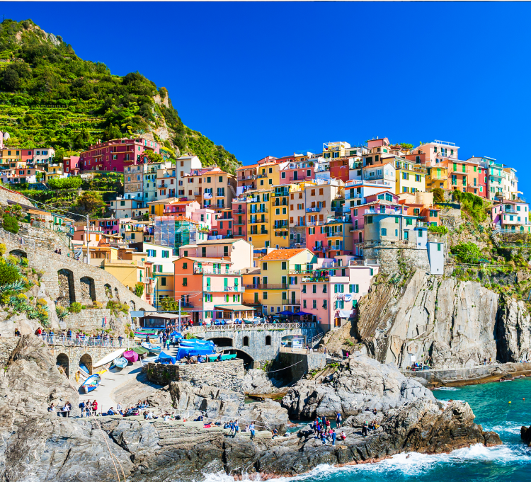 Image of colorful houses on a cliff.